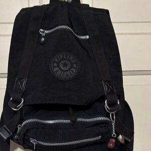 Kipling Woman’s Backpack in Black with five zipper pockets!